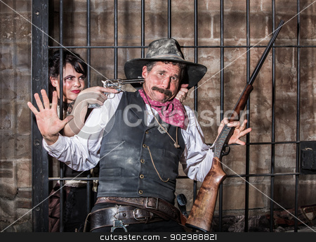 To use this stock image in your creative project, please select the size you need over to the right and click the "Add to Cart" button.
Your downloaded image will come with the Cutcaster watermark removed so don’t worry about the watermark you see on this page. Female Prisoner Steals Gun stock photo, Female Prisoner Steals Gun From Sheriff by Scott Griessel