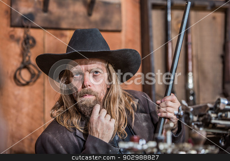 To use this stock image in your creative project, please select the size you need over to the right and click the "Add to Cart" button.
Your downloaded image will come with the Cutcaster watermark removed so don’t worry about the watermark you see on this page. Portrait of a Cowboy stock photo, Portrait of a Stern Cowboy by Scott Griessel