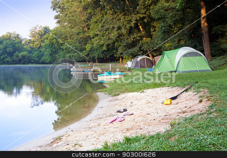 To use this stock image in your creative project, please select the size you need over to the right and click the "Add to Cart" button.
Your downloaded image will come with the Cutcaster watermark removed so don’t worry about the watermark you see on this page. Tents at the Lake stock photo, A family campsite at the lake illuminated by early morning sunlight. by Delmas Lehman