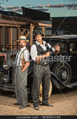 To use this stock image in your creative project, please select the size you need over to the right and click the "Add to Cart" button.
Your downloaded image will come with the Cutcaster watermark removed so don’t worry about the watermark you see on this page. Criminal Partners stock photo, 1920s era criminal partners with guns outdoors by Scott Griessel