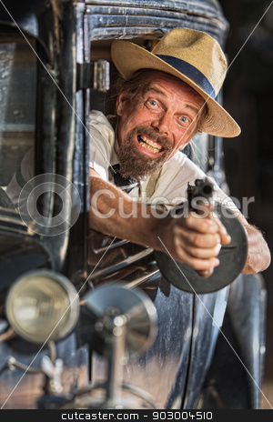 To use this stock image in your creative project, please select the size you need over to the right and click the "Add to Cart" button.
Your downloaded image will come with the Cutcaster watermark removed so don’t worry about the watermark you see on this page. Bearded Gangster Shooting From Car stock photo, Bearded man firing submachine gun from vintage 1920s car by Scott Griessel