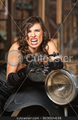 To use this stock image in your creative project, please select the size you need over to the right and click the "Add to Cart" button.
Your downloaded image will come with the Cutcaster watermark removed so don’t worry about the watermark you see on this page. Female Shooting Machine Gun stock photo, Aggressive 1920s female gangster shooting submachine gun by Scott Griessel