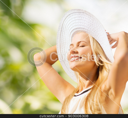 To use this stock image in your creative project, please select the size you need over to the right and click the "Add to Cart" button.
Your downloaded image will come with the Cutcaster watermark removed so don’t worry about the watermark you see on this page. beautiful woman enjoying summer outdoors stock photo, fashion and lifestyle concept - beautiful woman in hat enjoying summer outdoors by Syda Productions