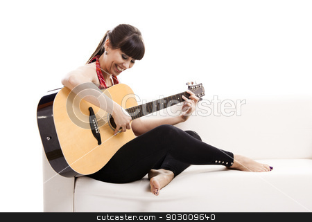 To use this stock image in your creative project, please select the size you need over to the right and click the "Add to Cart" button.
Your downloaded image will come with the Cutcaster watermark removed so don’t worry about the watermark you see on this page. Playing guitar stock photo, Beautiful woman sitting on the sofa and playing guitar, isolated on white by ikostudio