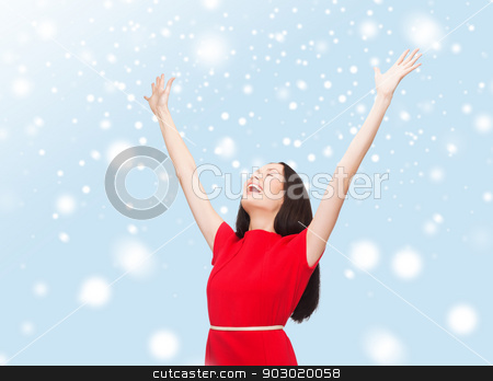 To use this stock image in your creative project, please select the size you need over to the right and click the "Add to Cart" button.
Your downloaded image will come with the Cutcaster watermark removed so don’t worry about the watermark you see on this page. smiling young woman in red dress waving hands stock photo, happiness and people concept - smiling young woman in red dress waving hands with closed eyes by Syda Productions