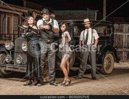 To use this stock image in your creative project, please select the size you need over to the right and click the "Add to Cart" button.
Your downloaded image will come with the Cutcaster watermark removed so don’t worry about the watermark you see on this page. Four Gangster Criminals with Guns stock photo, Dangerous 1920s vintage gangsters outside with weapons by Scott Griessel