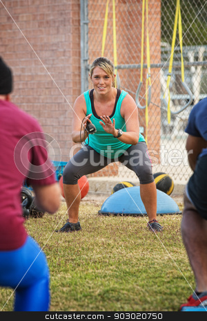 To use this stock image in your creative project, please select the size you need over to the right and click the "Add to Cart" button.
Your downloaded image will come with the Cutcaster watermark removed so don’t worry about the watermark you see on this page. Fitness Trainer Working Outside stock photo, Smiling fitness trainer working with students at boot camp by Scott Griessel