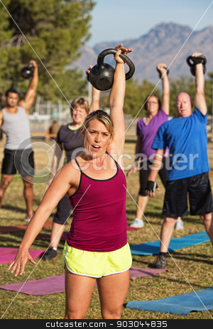 To use this stock image in your creative project, please select the size you need over to the right and click the "Add to Cart" button.
Your downloaded image will come with the Cutcaster watermark removed so don’t worry about the watermark you see on this page. Woman Leading Strength Training Class stock photo, Fit female leading strength training class outdoors by Scott Griessel