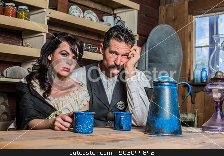 To use this stock image in your creative project, please select the size you need over to the right and click the "Add to Cart" button.
Your downloaded image will come with the Cutcaster watermark removed so don’t worry about the watermark you see on this page. Sad Western Sheriff and Woman Pose Inside House stock photo, Upset Western Sheriff Poses With a Woman Inside of a House by Scott Griessel