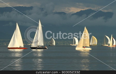To use this stock image in your creative project, please select the size you need over to the right and click the "Add to Cart" button.
Your downloaded image will come with the Cutcaster watermark removed so don’t worry about the watermark you see on this page. Sailboat race by sunset stock photo, Sailboat race on Geneva lake in front of Alps mountain by wonderful cloudy sunset by Elenarts