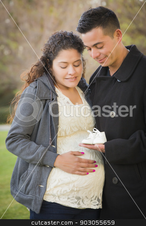 To use this stock image in your creative project, please select the size you need over to the right and click the "Add to Cart" button.
Your downloaded image will come with the Cutcaster watermark removed so don’t worry about the watermark you see on this page. Hispanic Pregnant Couple Holding Baby Shoes Outside stock photo, Happy Hispanic Pregnant Couple Holding Baby Shoes Outside in the Park. by Andy Dean