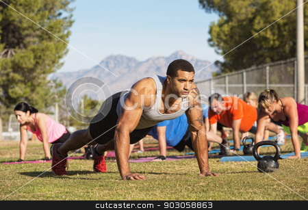 To use this stock image in your creative project, please select the size you need over to the right and click the "Add to Cart" button.
Your downloaded image will come with the Cutcaster watermark removed so don’t worry about the watermark you see on this page. Strong Man Doing Push-Ups stock photo, Strong man leading push-ups with exercise group by Scott Griessel