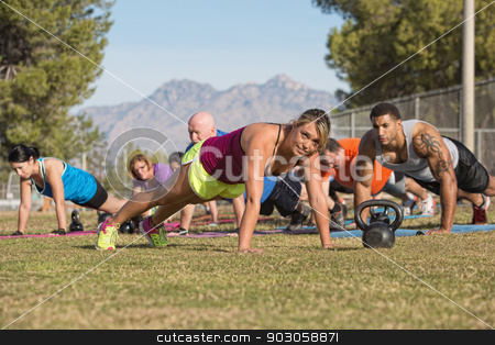 To use this stock image in your creative project, please select the size you need over to the right and click the "Add to Cart" button.
Your downloaded image will come with the Cutcaster watermark removed so don’t worry about the watermark you see on this page. Group Doing Push-Ups with Instructor stock photo, Cheerful blond fitness instructor leading group in push-ups by Scott Griessel