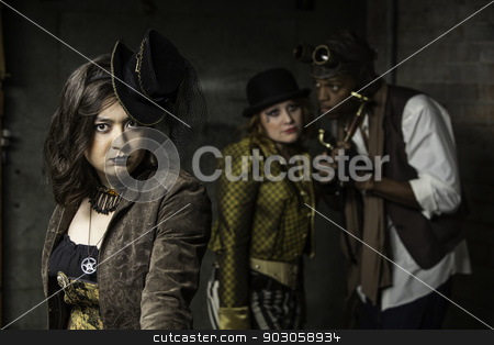 To use this stock image in your creative project, please select the size you need over to the right and click the "Add to Cart" button.
Your downloaded image will come with the Cutcaster watermark removed so don’t worry about the watermark you see on this page. Steampunk Trio stock photo, Young Steam Punks PosIng in Underground Lair by Scott Griessel