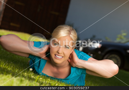 To use this stock image in your creative project, please select the size you need over to the right and click the "Add to Cart" button.
Your downloaded image will come with the Cutcaster watermark removed so don’t worry about the watermark you see on this page. gymnastic exercise stock photo, Blonde woman lying on a lawn and makes gymnastics practice by Roland Stollner