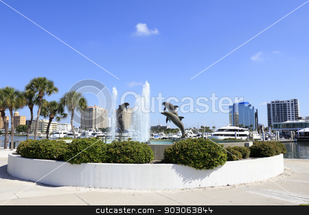 To use this stock image in your creative project, please select the size you need over to the right and click the "Add to Cart" button.
Your downloaded image will come with the Cutcaster watermark removed so don’t worry about the watermark you see on this page. Dolphin Fountain near Downtown stock photo, SARASOTA, FLORIDA - MAY 9, 2013: Dolphin Fountain sculpted by Steven C. Dickey, donated by Marina Jacks at the end of Sarasota Island Park and Marina with downtown buildings in the background. by Lee Serenethos