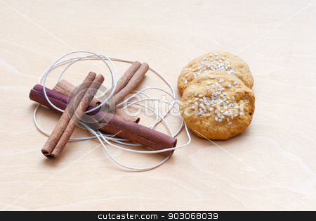 To use this stock image in your creative project, please select the size you need over to the right and click the "Add to Cart" button.
Your downloaded image will come with the Cutcaster watermark removed so don’t worry about the watermark you see on this page. biscuits, cinnamon sticks and a cord stock photo, biscuits, cinnamon sticks and a cord by Sergiy Artsaba