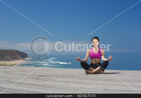 To use this stock image in your creative project, please select the size you need over to the right and click the "Add to Cart" button.
Your downloaded image will come with the Cutcaster watermark removed so don’t worry about the watermark you see on this page. Yoga Exercises stock photo, Beautiful young woman in outdoor doing yoga by ikostudio