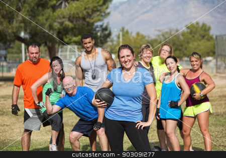 To use this stock image in your creative project, please select the size you need over to the right and click the "Add to Cart" button.
Your downloaded image will come with the Cutcaster watermark removed so don’t worry about the watermark you see on this page. Confident Fit Woman with Group stock photo, Smilng woman and boot camp fitness group with medicine ball by Scott Griessel