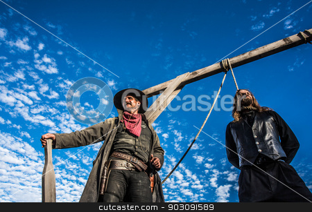 To use this stock image in your creative project, please select the size you need over to the right and click the "Add to Cart" button.
Your downloaded image will come with the Cutcaster watermark removed so don’t worry about the watermark you see on this page. Western Man Awaits Execution stock photo, Western Man Awaits Execution of Being Hung From the Neck At Gallows by Scott Griessel