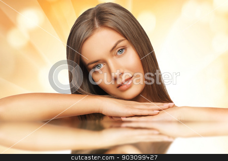 To use this stock image in your creative project, please select the size you need over to the right and click the "Add to Cart" button.
Your downloaded image will come with the Cutcaster watermark removed so don’t worry about the watermark you see on this page. beautiful woman with long hair stock photo, face and hands of beautiful woman with long hair by Syda Productions