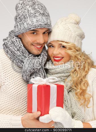 To use this stock image in your creative project, please select the size you need over to the right and click the "Add to Cart" button.
Your downloaded image will come with the Cutcaster watermark removed so don’t worry about the watermark you see on this page. romantic couple in a sweaters with gift box stock photo, picture of romantic couple in a sweaters with gift box by Syda Productions