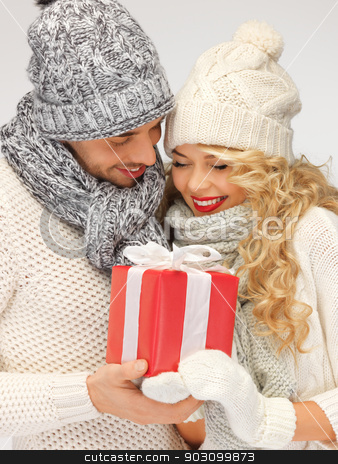 To use this stock image in your creative project, please select the size you need over to the right and click the "Add to Cart" button.
Your downloaded image will come with the Cutcaster watermark removed so don’t worry about the watermark you see on this page. romantic couple in a sweaters with gift box stock photo, picture of romantic couple in a sweaters with gift box by Syda Productions