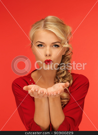 To use this stock image in your creative project, please select the size you need over to the right and click the "Add to Cart" button.
Your downloaded image will come with the Cutcaster watermark removed so don’t worry about the watermark you see on this page. woman blowing something on the palms of her hands stock photo, lovely woman in red dress blowing something on the palms of her hands by Syda Productions