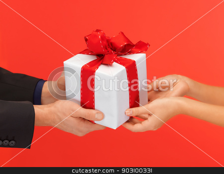 To use this stock image in your creative project, please select the size you need over to the right and click the "Add to Cart" button.
Your downloaded image will come with the Cutcaster watermark removed so don’t worry about the watermark you see on this page. man and woman's hands with gift box stock photo, closeup picture of man and woman's hands with gift box by Syda Productions