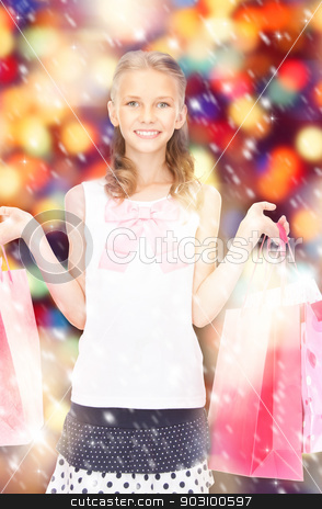 To use this stock image in your creative project, please select the size you need over to the right and click the "Add to Cart" button.
Your downloaded image will come with the Cutcaster watermark removed so don’t worry about the watermark you see on this page. little shopper stock photo, happy girl with shopping bags over christmas lights by Syda Productions