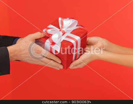 To use this stock image in your creative project, please select the size you need over to the right and click the "Add to Cart" button.
Your downloaded image will come with the Cutcaster watermark removed so don’t worry about the watermark you see on this page. man and woman's hands with gift box stock photo, closeup picture of man and woman's hands with gift box by Syda Productions