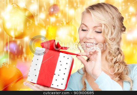 To use this stock image in your creative project, please select the size you need over to the right and click the "Add to Cart" button.
Your downloaded image will come with the Cutcaster watermark removed so don’t worry about the watermark you see on this page. happy woman with gift box stock photo, happy woman with gift box over christmas lights by Syda Productions