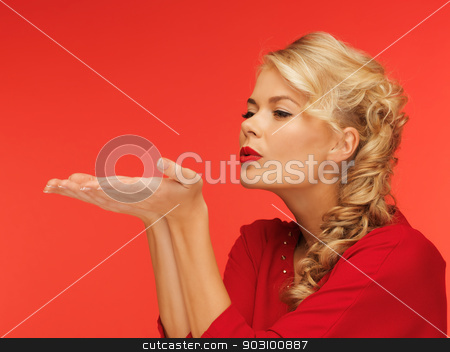 To use this stock image in your creative project, please select the size you need over to the right and click the "Add to Cart" button.
Your downloaded image will come with the Cutcaster watermark removed so don’t worry about the watermark you see on this page. woman blowing something on the palms of her hands stock photo, lovely woman in red dress blowing something on the palms of her hands by Syda Productions
