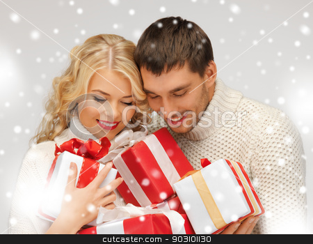 To use this stock image in your creative project, please select the size you need over to the right and click the "Add to Cart" button.
Your downloaded image will come with the Cutcaster watermark removed so don’t worry about the watermark you see on this page. romantic couple in a sweaters with gift boxes stock photo, picture of romantic couple in a sweaters with gift boxes by Syda Productions