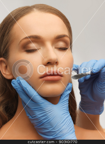 To use this stock image in your creative project, please select the size you need over to the right and click the "Add to Cart" button.
Your downloaded image will come with the Cutcaster watermark removed so don’t worry about the watermark you see on this page. woman face and beautician hands stock photo, picture of woman face and beautician hands with scalpel by Syda Productions