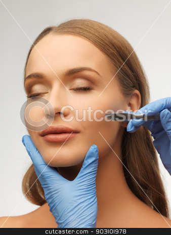 To use this stock image in your creative project, please select the size you need over to the right and click the "Add to Cart" button.
Your downloaded image will come with the Cutcaster watermark removed so don’t worry about the watermark you see on this page. woman face and beautician hands stock photo, picture of woman face and beautician hands with scalpel by Syda Productions