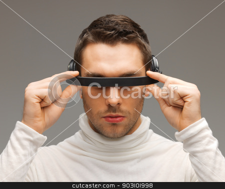 To use this stock image in your creative project, please select the size you need over to the right and click the "Add to Cart" button.
Your downloaded image will come with the Cutcaster watermark removed so don’t worry about the watermark you see on this page. man with futuristic glasses stock photo, picture of handsome man with futuristic glasses. by Syda Productions