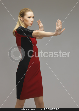 To use this stock image in your creative project, please select the size you need over to the right and click the "Add to Cart" button.
Your downloaded image will come with the Cutcaster watermark removed so don’t worry about the watermark you see on this page. woman working with something imaginary stock photo, picture of futuristic woman working with something imaginary by Syda Productions