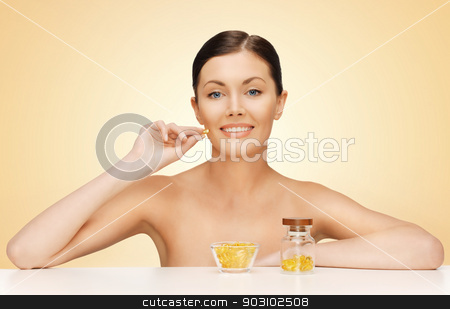 To use this stock image in your creative project, please select the size you need over to the right and click the "Add to Cart" button.
Your downloaded image will come with the Cutcaster watermark removed so don’t worry about the watermark you see on this page. woman with vitamins stock photo, bright picture of beautiful woman with vitamins by Syda Productions