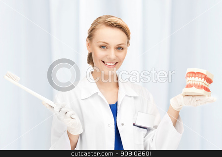 To use this stock image in your creative project, please select the size you need over to the right and click the "Add to Cart" button.
Your downloaded image will come with the Cutcaster watermark removed so don’t worry about the watermark you see on this page. attractive female doctor with toothbrush and jaws stock photo, picture of attractive female doctor with toothbrush and jaws by Syda Productions