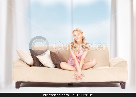 To use this stock image in your creative project, please select the size you need over to the right and click the "Add to Cart" button.
Your downloaded image will come with the Cutcaster watermark removed so don’t worry about the watermark you see on this page. happy woman on sofa stock photo, bright picture of happy woman on sofa by Syda Productions