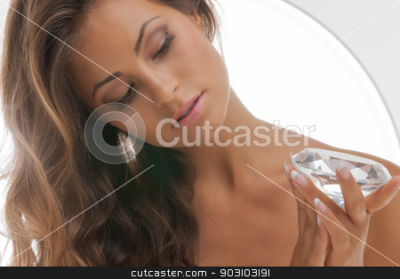 To use this stock image in your creative project, please select the size you need over to the right and click the "Add to Cart" button.
Your downloaded image will come with the Cutcaster watermark removed so don’t worry about the watermark you see on this page. beautiful woman with diamond stock photo, face and hands of beautiful woman with diamond by Syda Productions