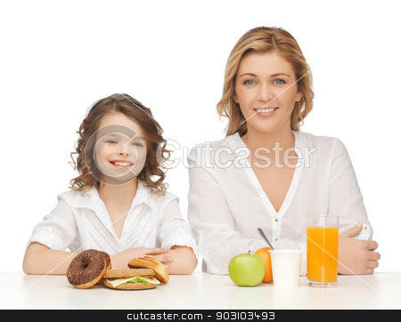 To use this stock image in your creative project, please select the size you need over to the right and click the "Add to Cart" button.
Your downloaded image will come with the Cutcaster watermark removed so don’t worry about the watermark you see on this page. mother and daughter stock photo, mother and daughter with healthy and unhealthy food by Syda Productions