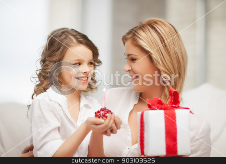 To use this stock image in your creative project, please select the size you need over to the right and click the "Add to Cart" button.
Your downloaded image will come with the Cutcaster watermark removed so don’t worry about the watermark you see on this page. mother and daughter stock photo, picture of mother and daughter with cupcake by Syda Productions