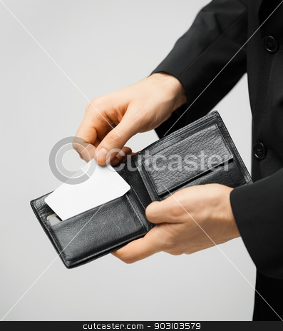 To use this stock image in your creative project, please select the size you need over to the right and click the "Add to Cart" button.
Your downloaded image will come with the Cutcaster watermark removed so don’t worry about the watermark you see on this page. man in suit holding credit card stock photo, man in suit with wallet and credit card. by Syda Productions
