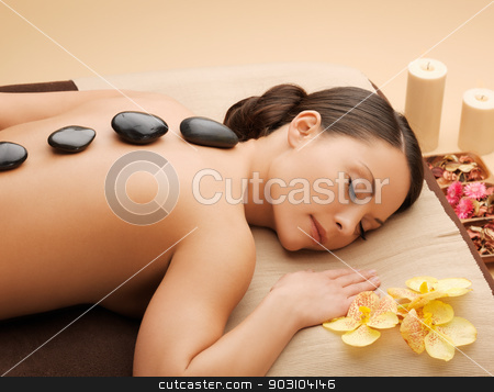 To use this stock image in your creative project, please select the size you need over to the right and click the "Add to Cart" button.
Your downloaded image will come with the Cutcaster watermark removed so don’t worry about the watermark you see on this page. beautiful woman with hot stones stock photo, picture of woman in spa salon with hot stones by Syda Productions