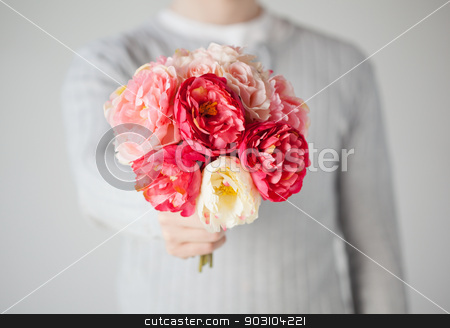 To use this stock image in your creative project, please select the size you need over to the right and click the "Add to Cart" button.
Your downloaded image will come with the Cutcaster watermark removed so don’t worry about the watermark you see on this page. man giving bouquet of flowers stock photo, close up of young man giving bouquet of flowers. by Syda Productions