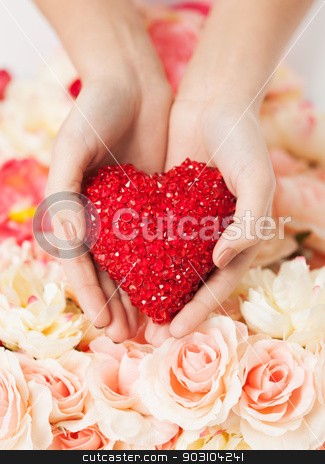 To use this stock image in your creative project, please select the size you need over to the right and click the "Add to Cart" button.
Your downloaded image will come with the Cutcaster watermark removed so don’t worry about the watermark you see on this page. woman's hands holding heart stock photo, close up of woman's hands holding heart by Syda Productions