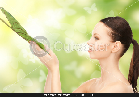 To use this stock image in your creative project, please select the size you need over to the right and click the "Add to Cart" button.
Your downloaded image will come with the Cutcaster watermark removed so don’t worry about the watermark you see on this page. woman with green leaf stock photo, picture of woman with green leaf by Syda Productions