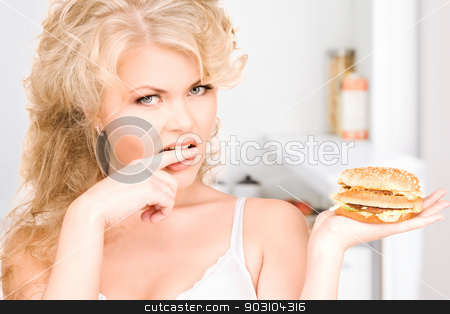 To use this stock image in your creative project, please select the size you need over to the right and click the "Add to Cart" button.
Your downloaded image will come with the Cutcaster watermark removed so don’t worry about the watermark you see on this page. woman with burger stock photo, young beautiful woman with burger by Syda Productions